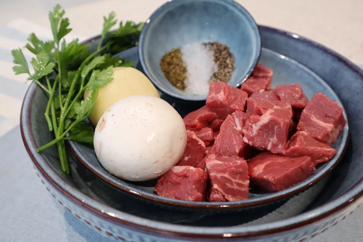 Bowl of raw beef and vegetables for beef vegetable baby purée recipe